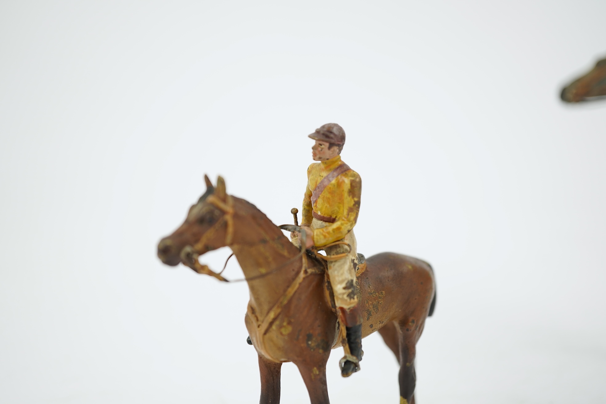 Two Austrian cold-painted bronze figures groups of jockeys on racehorses, early 20th century